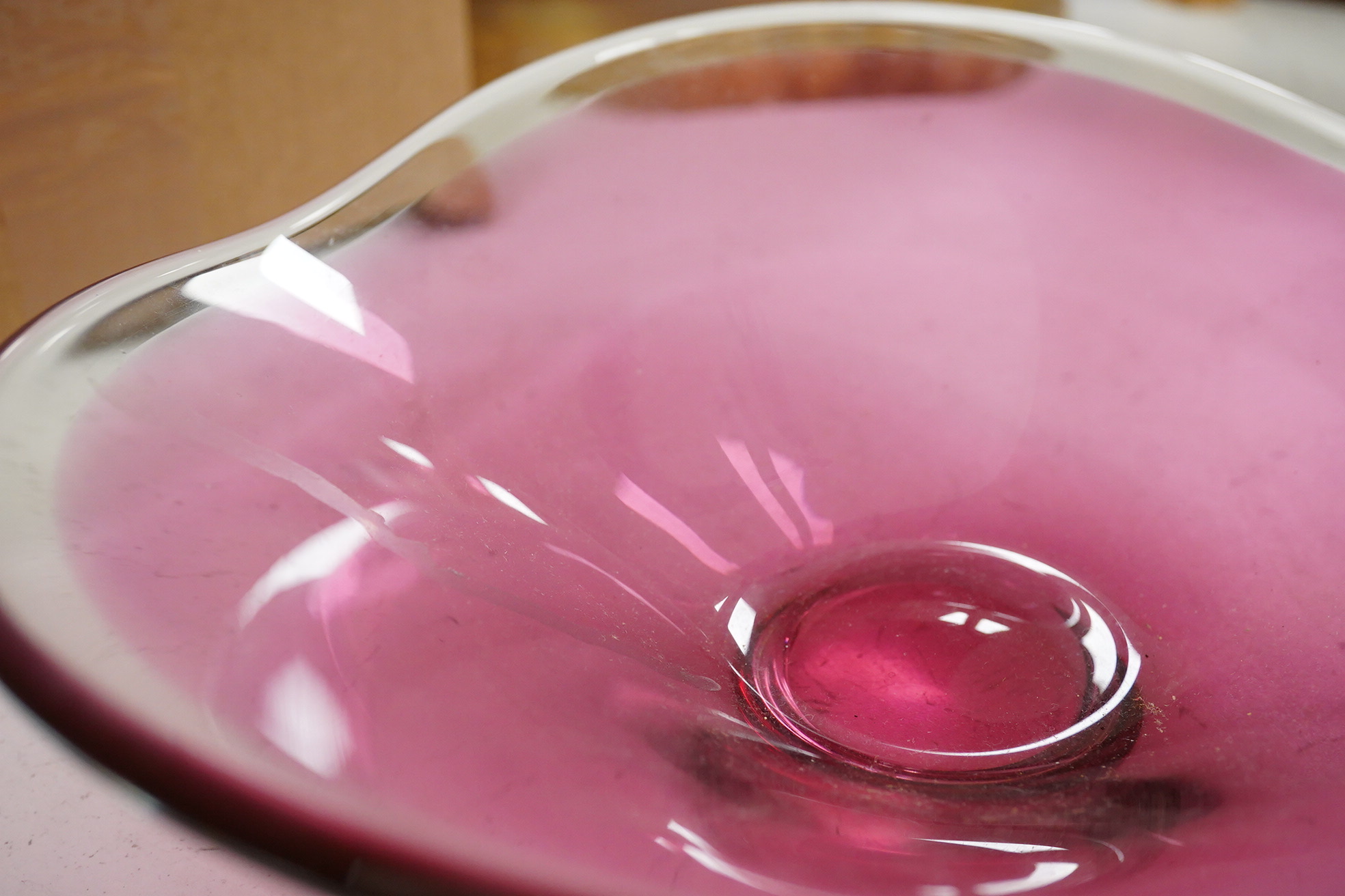 Michael Magyar, a cranberry glass dish, signed to the base, 26cm wide